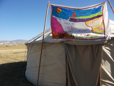 File:HCSM Banner Over Yurt at BBF2012.jpg