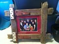 A custom picture frame made from wood of a hundred year old barn.