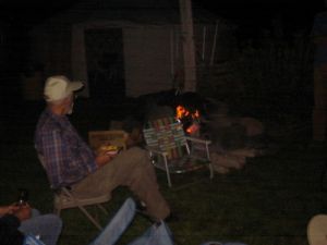 Brother Gregory eating by the campfire.jpg